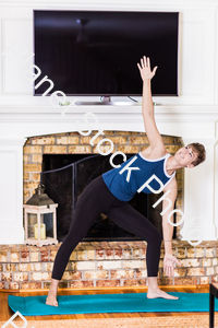 A young lady working out at home stock photo with image ID: 6c9d72dd-289a-48b5-9250-a35a73834056