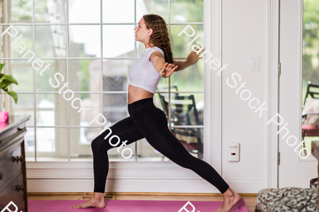 A young lady working out at home stock photo with image ID: 704e1a4f-eb7f-46d4-9534-0660d13b95a3