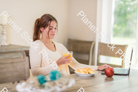 A young lady having a healthy breakfast stock photo with image ID: 70adc3d6-7880-4b87-a049-dfbad1d5a087