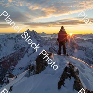 A Man Standing on the Top of a Amountain stock photo with image ID: 74c60a4b-875e-488e-9ae3-cf0a6cb6765e