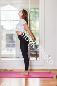 A young lady working out at home stock photo with image ID: 7576112a-3f2e-481d-a80f-8b42a73d9d27