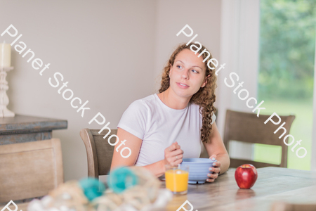 A young lady having a healthy breakfast stock photo with image ID: 7704eb81-e0c1-4cb4-92b8-22e9066bd731