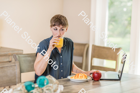 A young lady having a healthy breakfast stock photo with image ID: 7b7161cc-bfea-4a28-8e7c-74b41da8e4cb