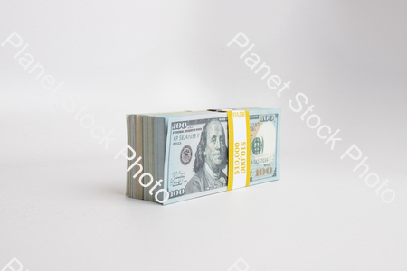 Three stacks of dollar-bills stock photo with image ID: 7d9f5d55-f31b-49f5-8806-e9d707ec21bd