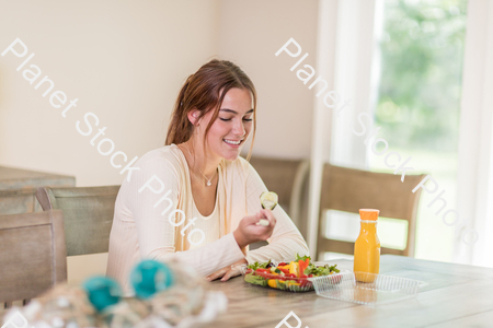 A young lady having a healthy meal stock photo with image ID: 7f824940-85b8-454f-84d7-dd88a980222e