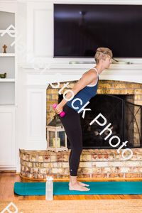 A young lady working out at home stock photo with image ID: 80cf5ae4-ec3f-4972-9722-692b4f059c69