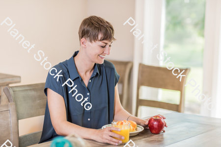 A young lady having a healthy breakfast stock photo with image ID: 8189fc7e-dfef-42cd-b35a-9a73481c8890