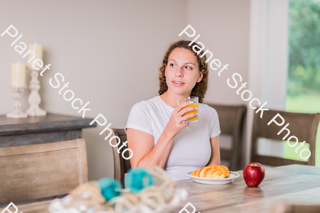 A young lady having a healthy breakfast stock photo with image ID: 84c7cd62-2903-485b-a577-4025447cb68e