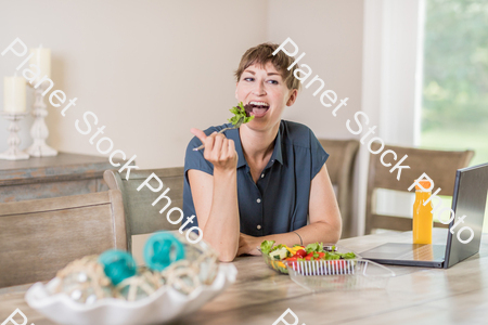 A young lady having a healthy meal stock photo with image ID: 885a0a8d-4bc3-415d-9c3e-760df9a51e7c