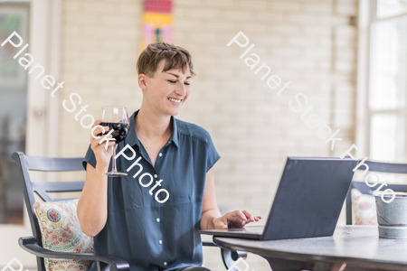 A young lady enjoying daylight at home stock photo with image ID: 8ab02856-acc4-4f5f-b396-81782f2d2448