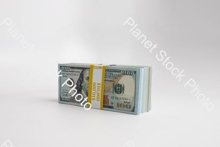 Three stacks of dollar bills stock photo with image ID: 8f14764a-f93f-4121-aa7e-d6f02bae8f11