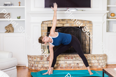 A young lady working out at home stock photo with image ID: 9136d598-2cab-4246-b69d-09ec807bcfda