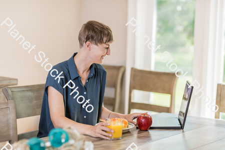 A young lady having a healthy breakfast stock photo with image ID: 968d97e8-c6dd-4d07-bc6e-e0124cd46588