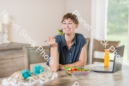 A young lady having a healthy meal stock photo with image ID: 97ebf394-ebe2-4a66-8f52-6b561903980c