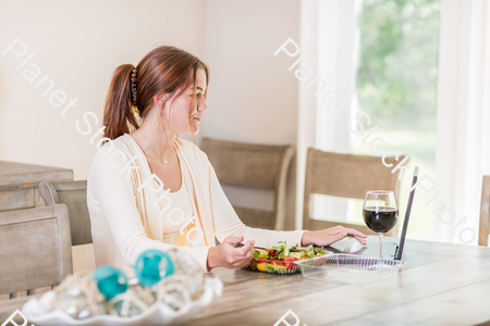 A young lady having a healthy meal stock photo with image ID: 9ff97425-b1b2-4145-8ea1-2cec1599e304