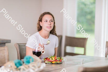 A young lady having a healthy meal stock photo with image ID: a00df696-57b2-4971-8e32-05408abd7b3c