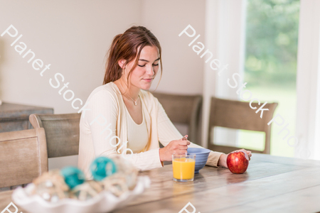A young lady having a healthy breakfast stock photo with image ID: a160aa21-43c6-4ce4-8024-7460872efe9f