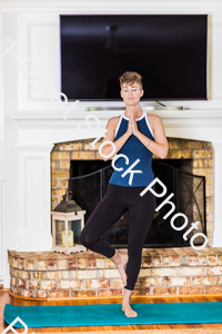A young lady working out at home stock photo with image ID: ad2aa79f-d7dd-48c9-aa3c-1cc82b542743