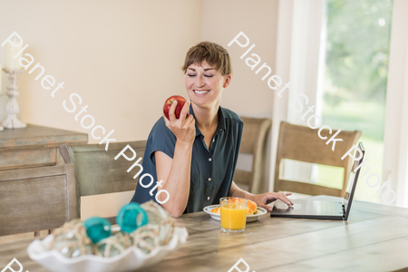 A young lady having a healthy breakfast stock photo with image ID: b031cad3-1575-47fe-90e3-32795d97b1d8