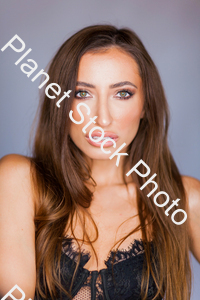 Face shot of a model in black outfit in a studio photoshoot stock photo with image ID: b0785ea7-8bf0-49c4-9cc9-3921fc0a6459