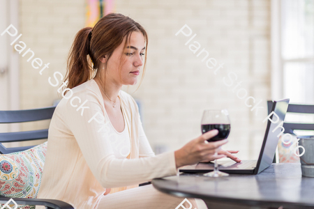 A young lady enjoying daylight at home stock photo with image ID: b191ac8d-a889-4d43-b4b0-0d35bae60325