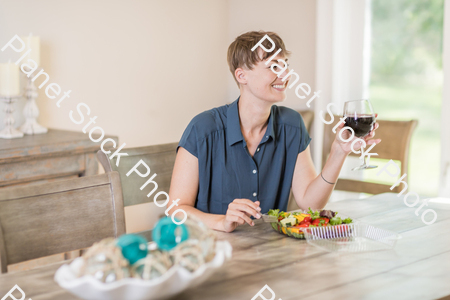 A young lady having a healthy meal stock photo with image ID: b1cffeed-24de-4417-a718-319a8c73216b