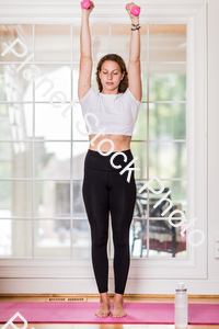 A young lady working out at home stock photo with image ID: b39d2cbc-62b7-4670-bd52-530567c2824a