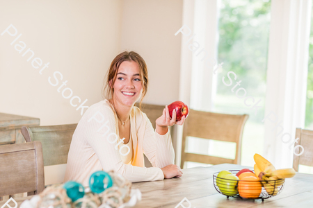 A young lady grabbing fruit stock photo with image ID: b53b3c3f-4ddb-47d8-8422-3d5ee6c1df5a