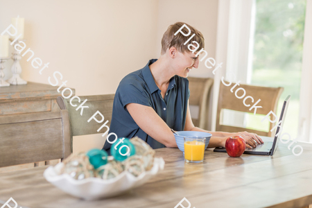 A young lady having a healthy breakfast stock photo with image ID: baf8437b-8763-4546-b0ed-1f5a72edefc0