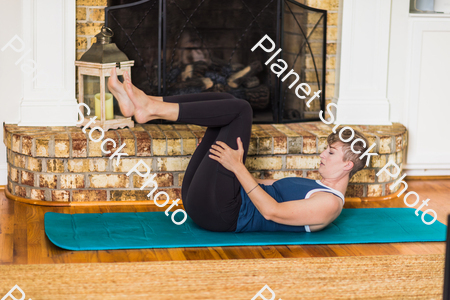 A young lady working out at home stock photo with image ID: bb3d70cb-25d9-4d73-85bf-4e99992d17f7