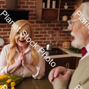 Creepy Grandpa Laughing Cutely while Staring at His Beautiful Wife Who Is Smiling Creepily stock photo with image ID: bc427b18-1618-421a-b89c-002bbafc48f3