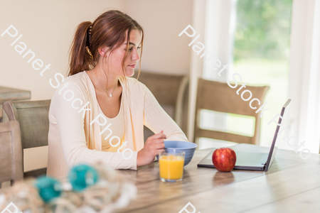 A young lady having a healthy breakfast stock photo with image ID: c1ac09e8-a668-4c7a-9a06-a1ee81799cfb