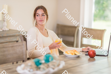 A young lady having a healthy breakfast stock photo with image ID: c2be4de7-3955-4d19-8b31-3dc2710ed4f3