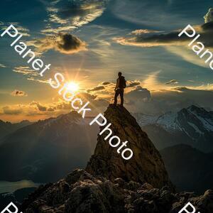 A Man Standing on the Top of a Amountain stock photo with image ID: c401120b-4a5d-476d-9871-f3ba8529b8b1