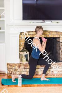 A young lady working out at home stock photo with image ID: c5cf1f5c-38f1-42c5-a361-d9be5ef4d49e