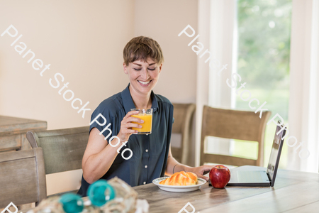 A young lady having a healthy breakfast stock photo with image ID: cb69ad9b-ebc5-450c-aa2f-0984649a4fc9
