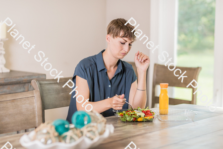 A young lady having a healthy meal stock photo with image ID: cdbe4861-f863-4eee-b1fe-e1fd345374fd