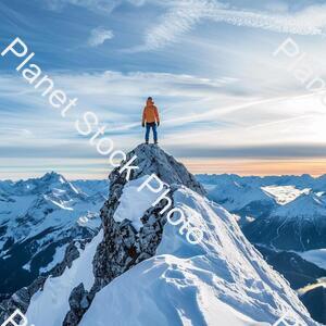 A Man Standing on the Top of a Amountain stock photo with image ID: ce9f4d19-86fd-4042-86bc-c2fe528b813c