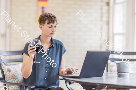 A young lady enjoying daylight at home stock photo with image ID: dcd93a9a-0e2e-48d5-9955-ac1b40f685b1