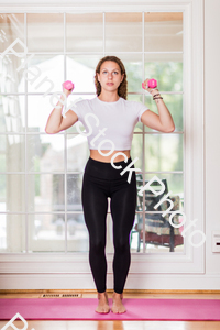 A young lady working out at home stock photo with image ID: e4c2010e-5e5c-4b20-b42b-7eb8b76c8220