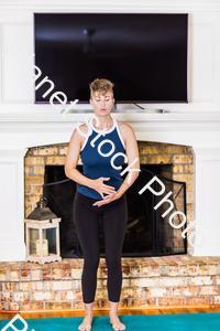 A young lady working out at home stock photo with image ID: e560282c-3401-494a-8bb8-ea82b5406726