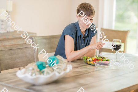 A young lady having a healthy meal stock photo with image ID: e9151f39-3771-46dd-b0f5-2e907e9d5486