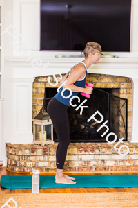 A young lady working out at home stock photo with image ID: ea406087-1837-4448-a347-fd973d057e67