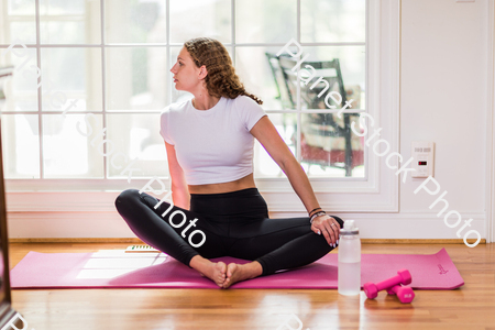 A young lady working out at home stock photo with image ID: ecb8abfa-2210-4e1a-b43d-407e8d73d7ca