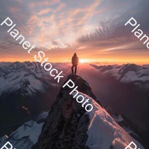 A Man Standing on the Top of a Amountain stock photo with image ID: f137b16d-d188-483b-ae09-e10fab5ce577