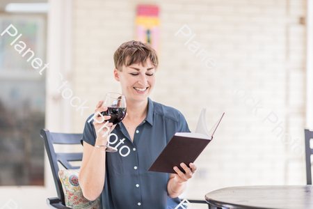 A young lady enjoying daylight at home stock photo with image ID: f6b223d0-e571-4360-90c9-3a270c1d764e