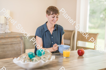 A young lady having a healthy breakfast stock photo with image ID: fc9748eb-dfc4-4f3d-af96-c81a4897111e