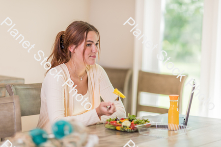 A young lady having a healthy meal stock photo with image ID: fdd0c31c-522b-41c5-9371-11bedfc2c264