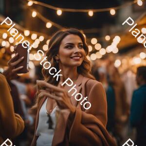 Show a Lady in a Modern Day Market Taking Selfies and the People Are Gathered Around Her stock photo with image ID: fe07d304-43e6-42c9-8cb0-ed41995c1778