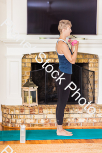 A young lady working out at home stock photo with image ID: ff2c55fd-1970-4e2d-9b3a-cb5263748d7c